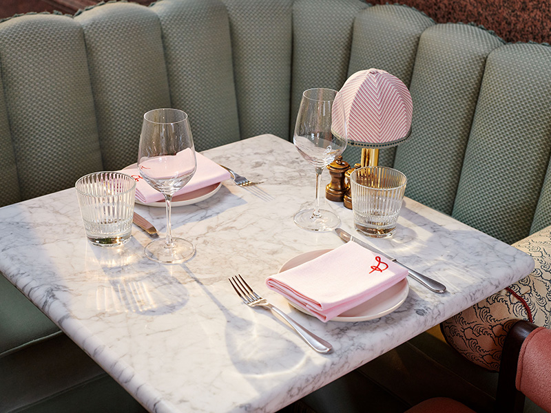 Set table in The Spence with green corner seat