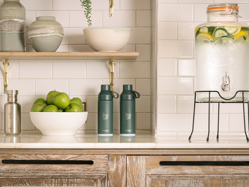 Bottles, fruit and water ona marble table in the pantry of the gym at Gleneagles Townhouse