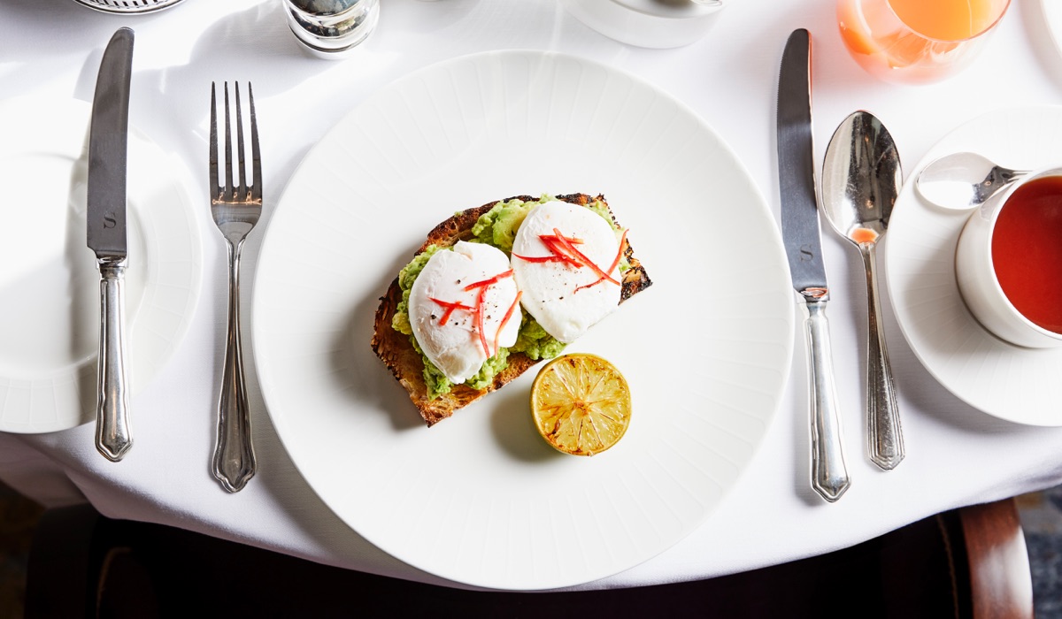 Poached egg and avocado on toast on a white plat in the Strathearn at Gleneagles