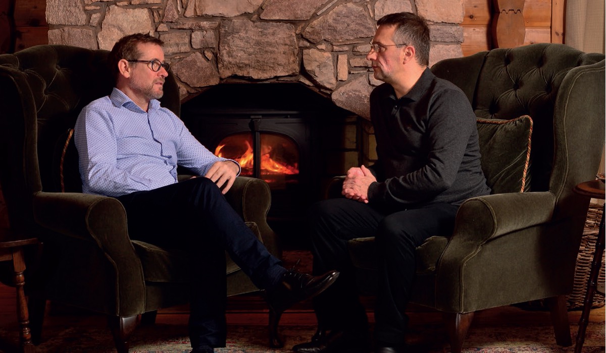 Andrew Failrie and Michel Roux chat next to an open fire in the Shooting Lodge at Gleneagles