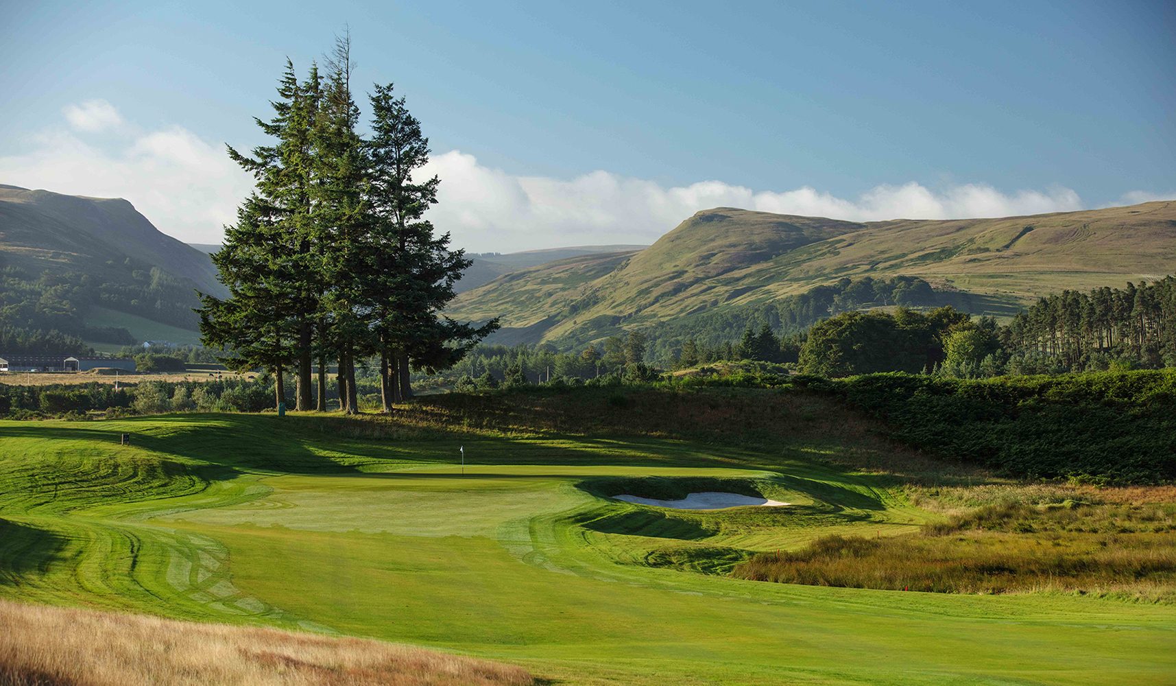 A view of the Gleneagles golf courses on an autumnal day with the Ochil Hills in the background