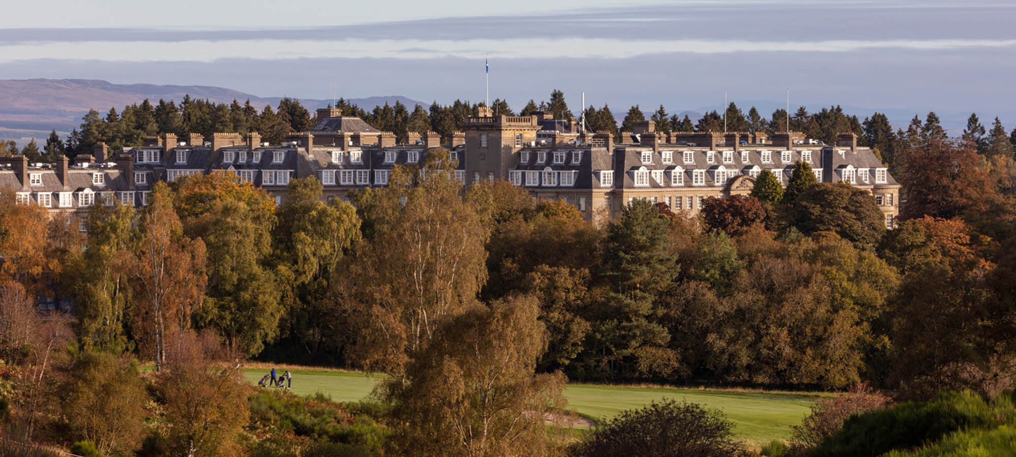Gleneagles hotel in the autumn with hills in the background