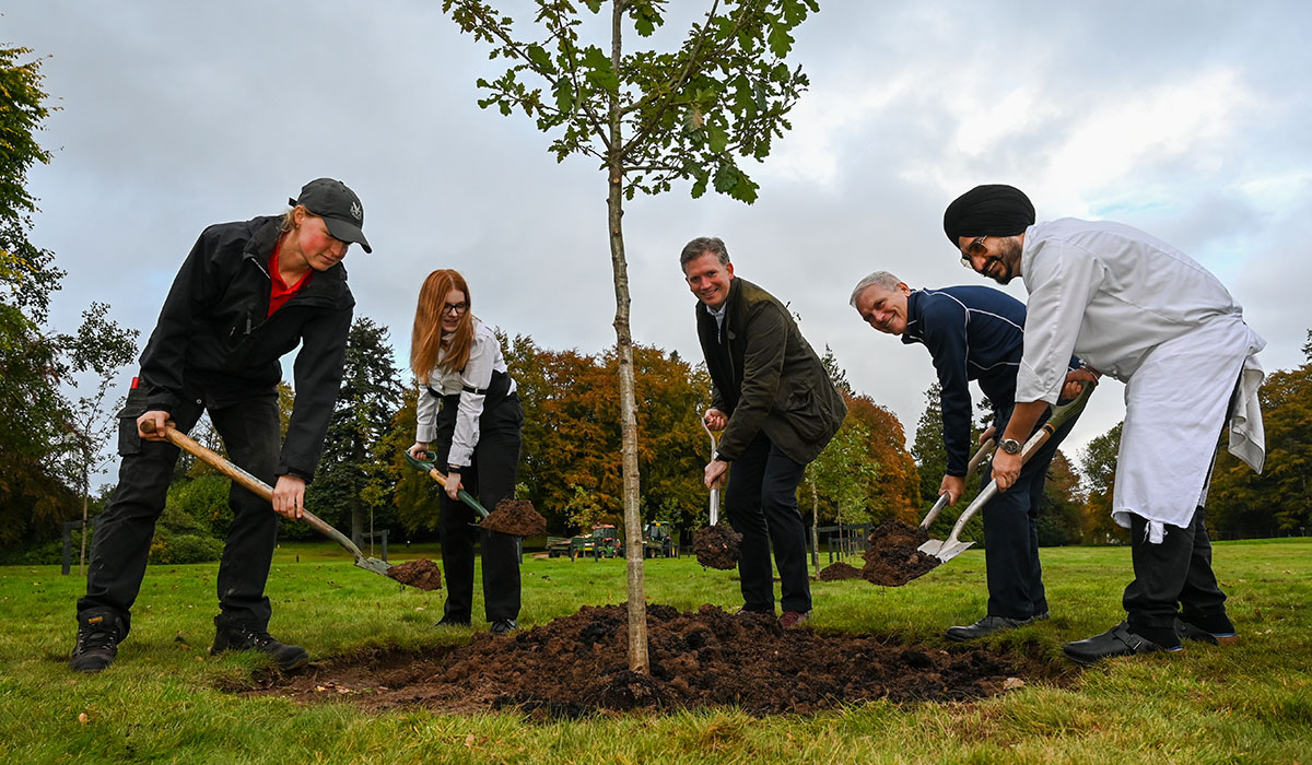 Members of staff at Gleneagles planting a tree