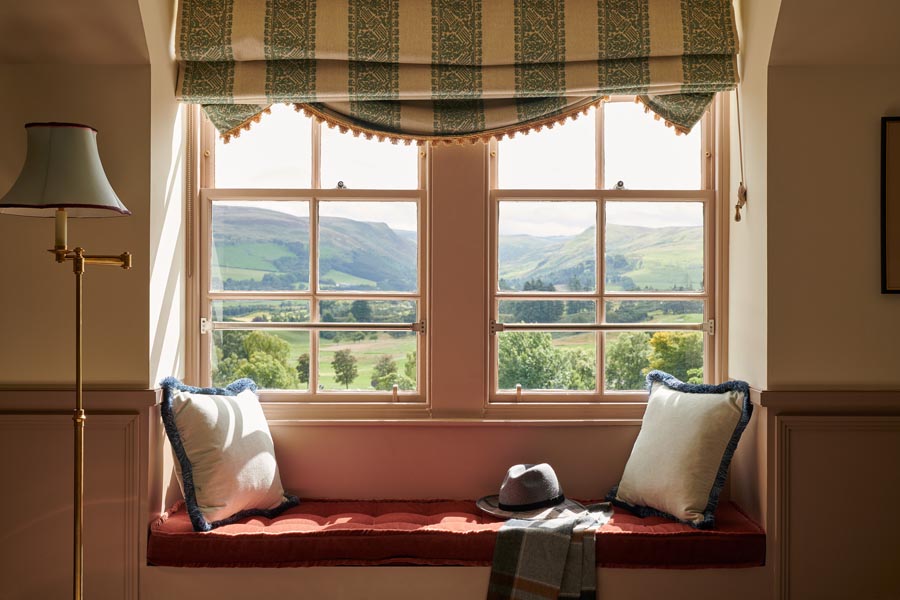 A bay window seating area looking out over the Ochil hills in a Two bedroom whisky suite at Gleneagles