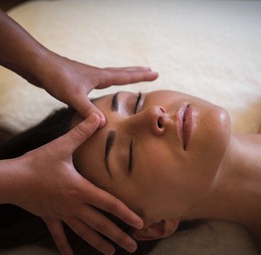 A woman receives a face massage