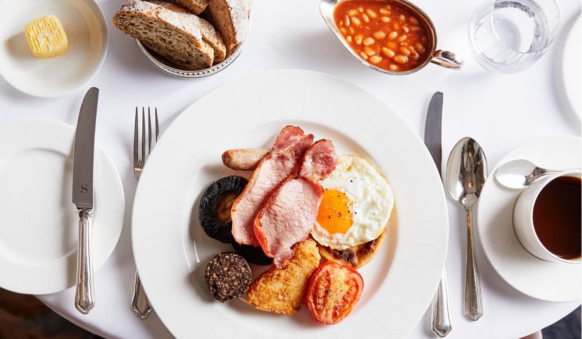A full Scottish breakfast with side of beans and toast and a black coffee in The Strathearn