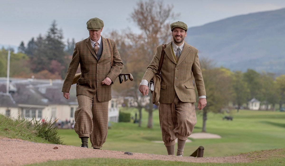 Two Gleneagles staff dressed in vintage golf attire