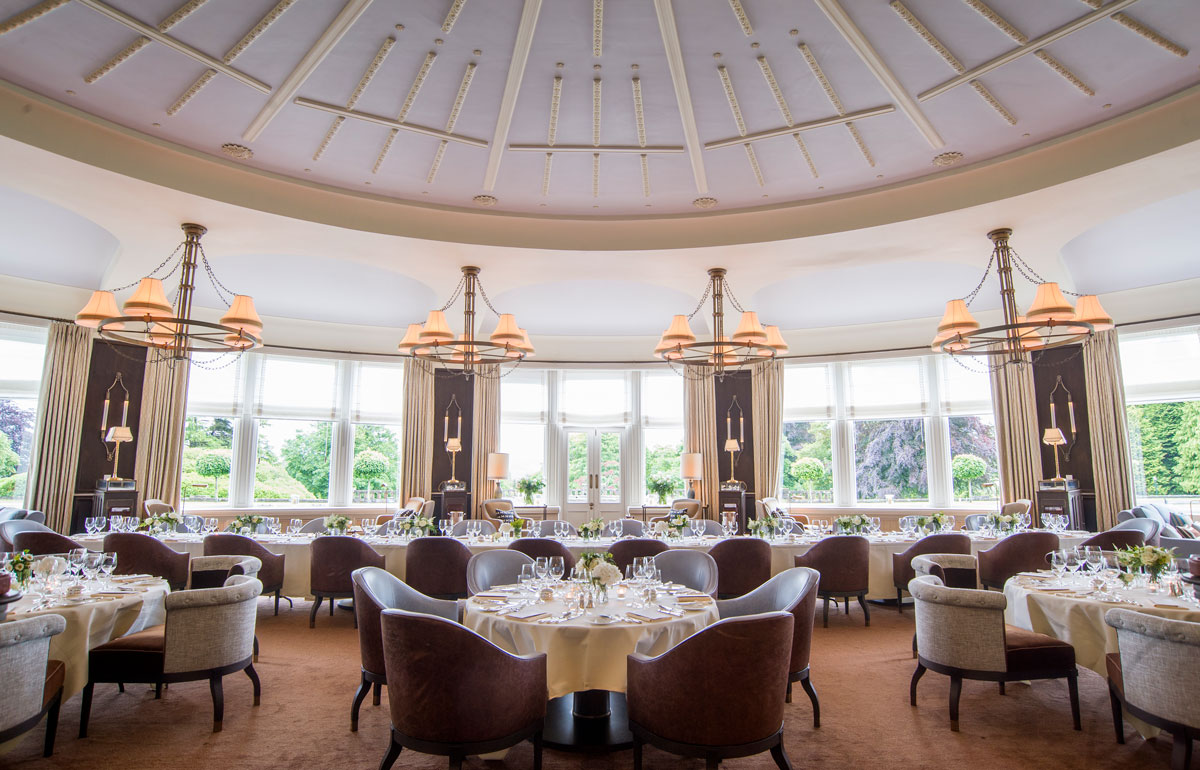 The glendezon set up for a silver service dinner with views out on to the front lawn at Gleneagles