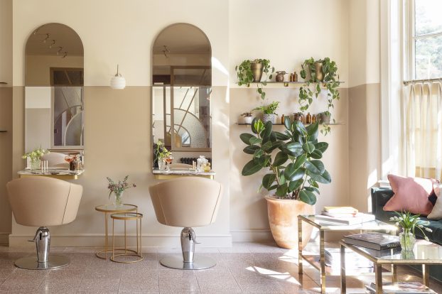 Two white salon chairs in front of a mirror in Bob & Cloche, our beauty lodge at Gleneagles