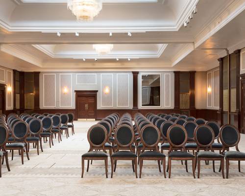 The Henry hall set up theatre style with long rows of chairs facing the camera