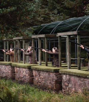 A group of people shoot clays