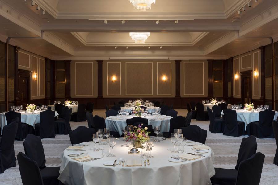 The Henry hall set up for dinner with large round tables