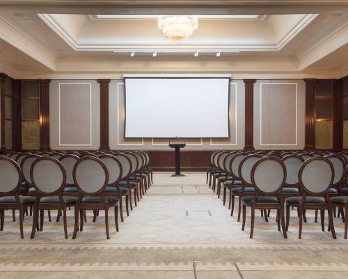 The Henry hall set with projection screen and theatre-style chairs