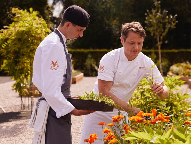 Two Gleneagles chefs pick edible flowers from the kitchen garden to prepare