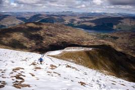 Runners climb through the snow on Ben Vorlich