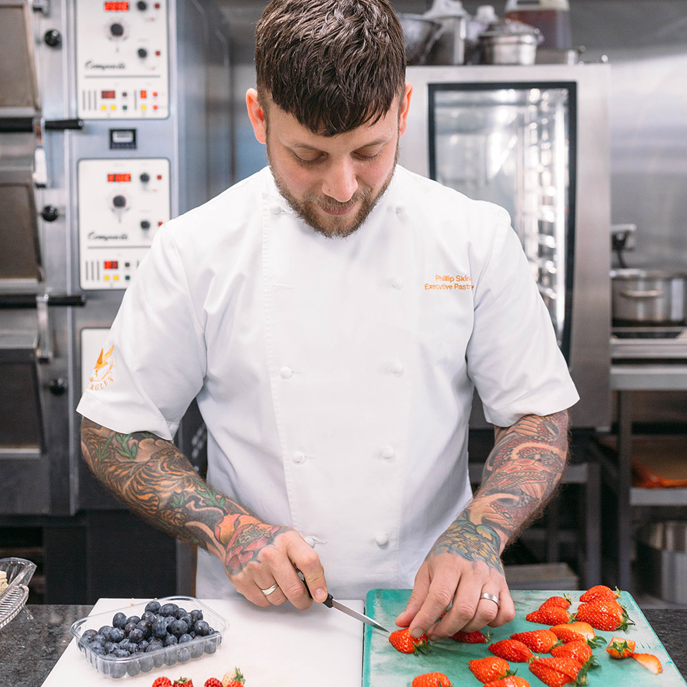 Pastrychef Phil Skinazi chopping strawberries