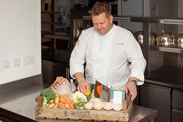 Executive Chef Simon Attridge with a hamper of food