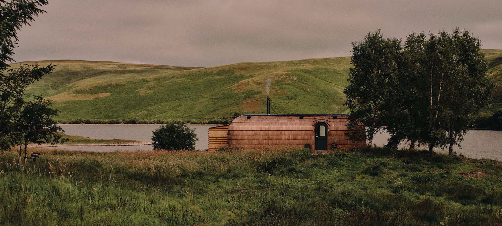 Landscape setting showing Frandy sauna exterior