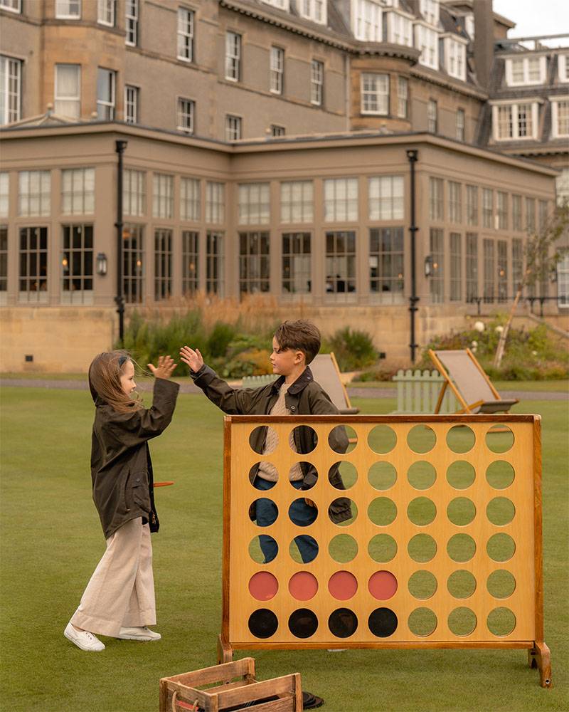 Children playing giant Connect Four on Gleneagles lawn