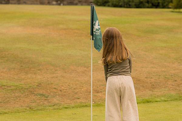 Young girl playing golf on Gleneagles Course