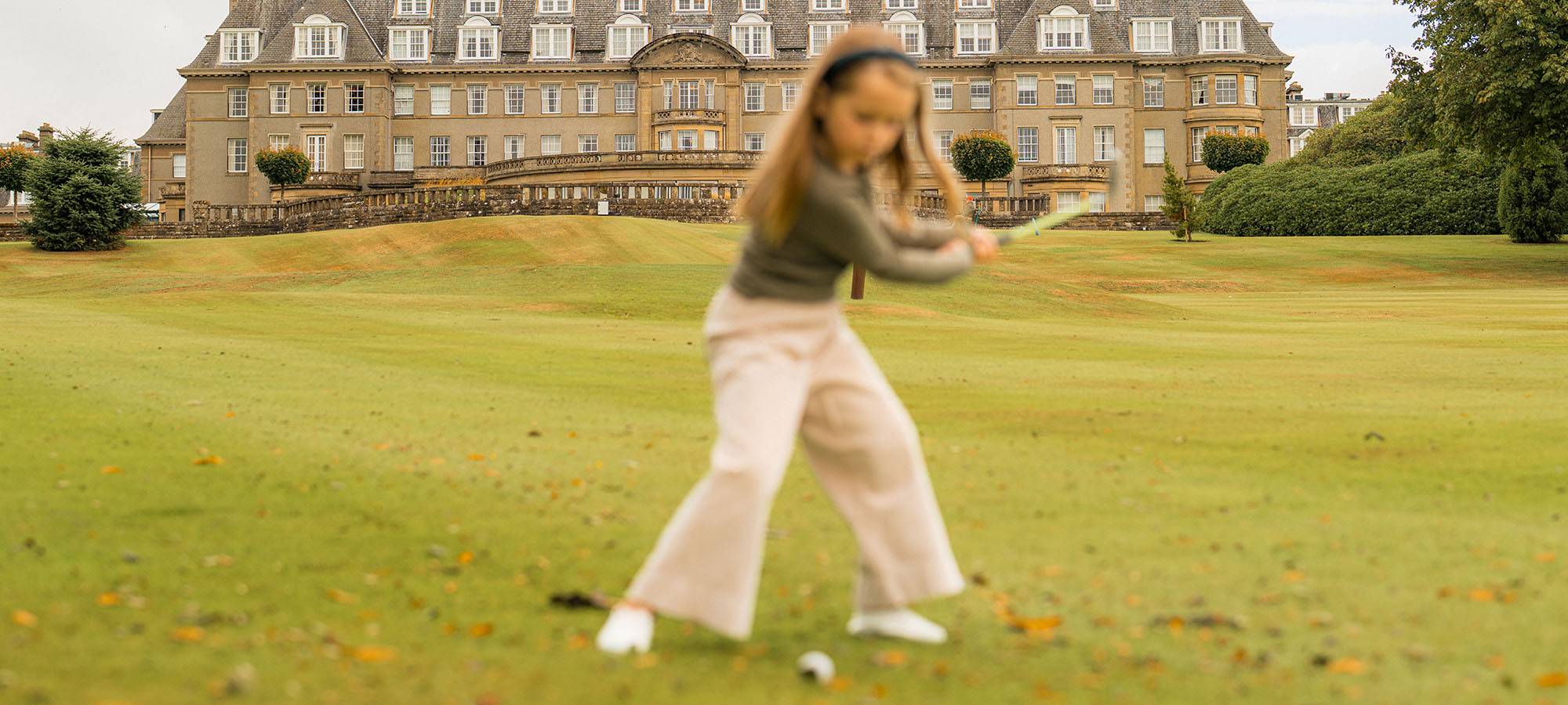 Young girl playing mini golf on Gleneagles course